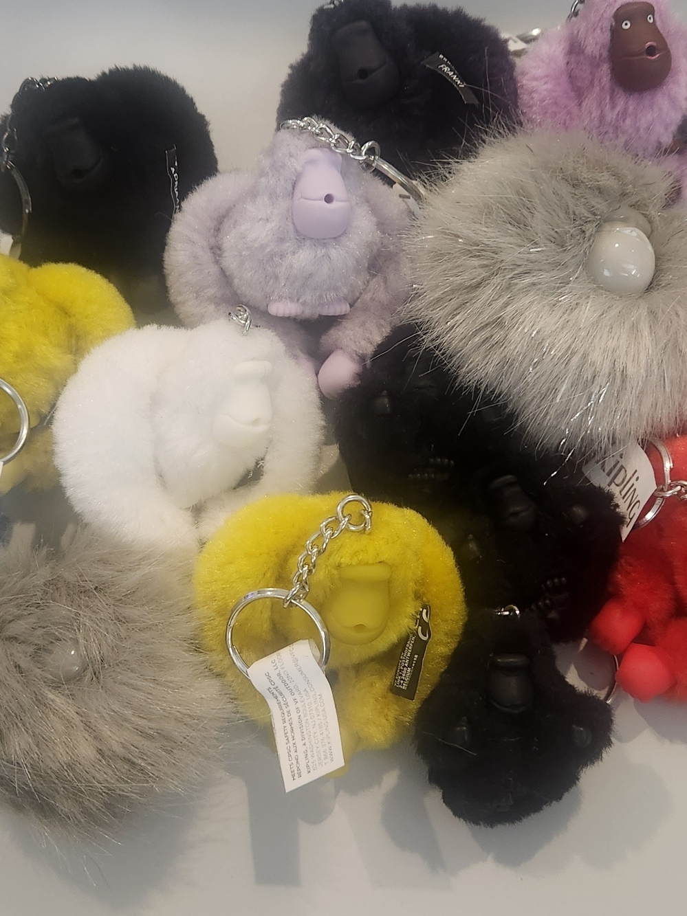 Kipling Plush Monkey Keychain - Yellow, White, Black, Gray, Purple